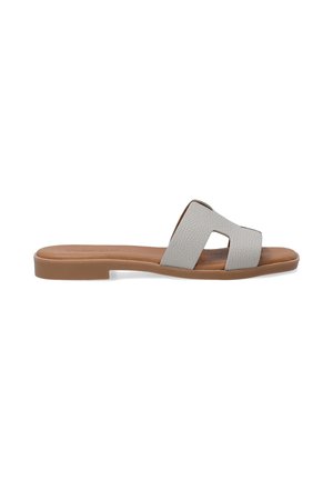 Gray leather slide sandal with an open toe design, featuring a wide strap and cut-out detail. Tan flat sole for comfort.