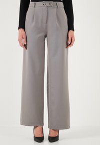 Gray wide-leg trousers featuring a high waist and front pleats, with two decorative buttons at the waistband and a smooth fabric texture.