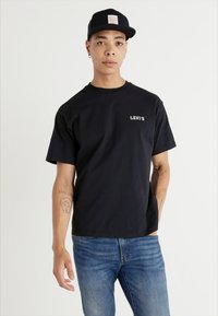 Levi's® VINTAGE FIT GRAPHIC - Nyomott mintás póló - black