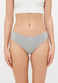 Gray cotton bikini panties with a wider waistband featuring the word "COPENHAGEN" in white. Smooth texture and a simple design.