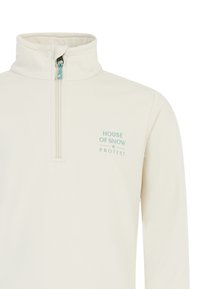 Lichtbeige pullover met een hoge kraag, halve rits en teal logo tekst. Gladde textuur en comfortabele pasvorm, geschikt voor casual draag.