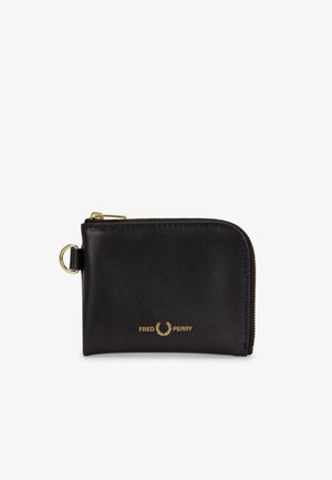 Black leather zippered wallet with gold zipper and ring, featuring Fred Perry logo in gold on front.
