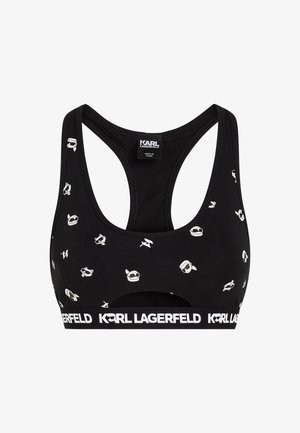 Črna športna modrčka z belimi dizajni Karl Lagerfeld, vključno z ikonami in vzorci. Ima širok pas z logotipom in obliko racerback. Material mešanica bombaža.