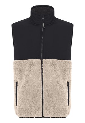 Black sleeveless vest with a high collar, featuring a beige fleece lower section, side pockets, and a front zipper. Soft texture.