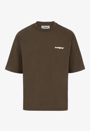Maglietta marrone oversize a maniche corte con collo tondo e piccolo logo bianco "lowlights" sul petto sinistro.