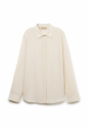 Beiges Langarm-Hemd mit Knöpfen, spitzem Kragen und verdeckten Knöpfen, auf weißem Hintergrund dargestellt.