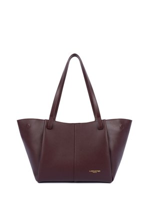 Borsa a mano in pelle marrone scuro con due manici e piccolo logo dorato "Lancaster Paris" nella parte anteriore in basso a destra.