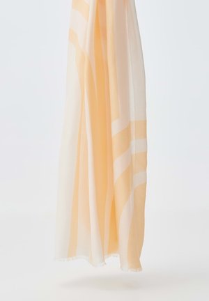 Foulard leggero in morbido tessuto trasparente. Presenta strisce alternate in arancione chiaro e bianco. I bordi sono frangiati per un tocco delicato.