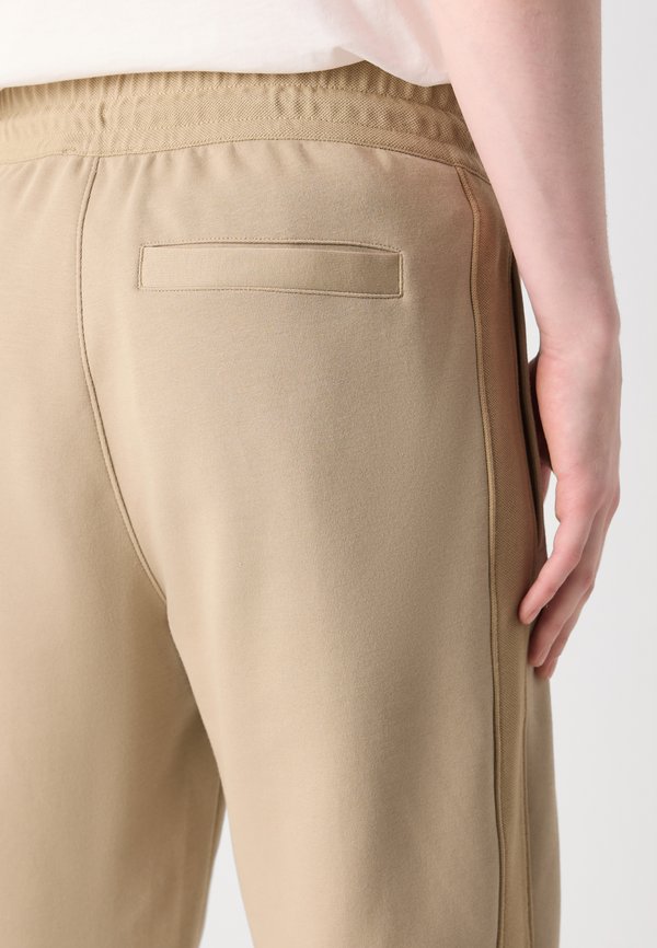 LOGO TAPE SWEATPANT - Tracksuit bottoms - tree house3