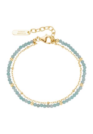 Double-layer bracelet with small gold chain and light blue beads, gold clasp, and a tag engraved with Giorgio Martello.