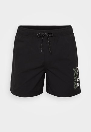 Black swim shorts made of lightweight material, featuring an elastic waistband with a drawstring and a logo printed in green on the side.