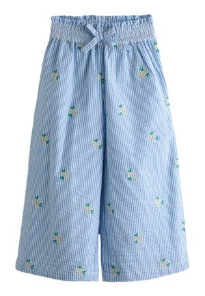 Modré a biele široké nohavice s vertikálnymi pruhmi, elastickým pásom, prednými vreckami, mašličkou a malou žlto-bielou kvetinovou výšivkou.