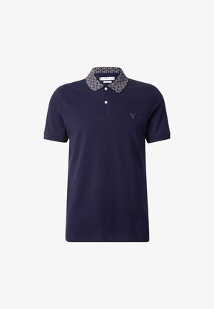 Polo marino con cuello estampado, tapeta de tres botones y un pequeño logo en el pecho. Fabricado en un tejido suave y transpirable.