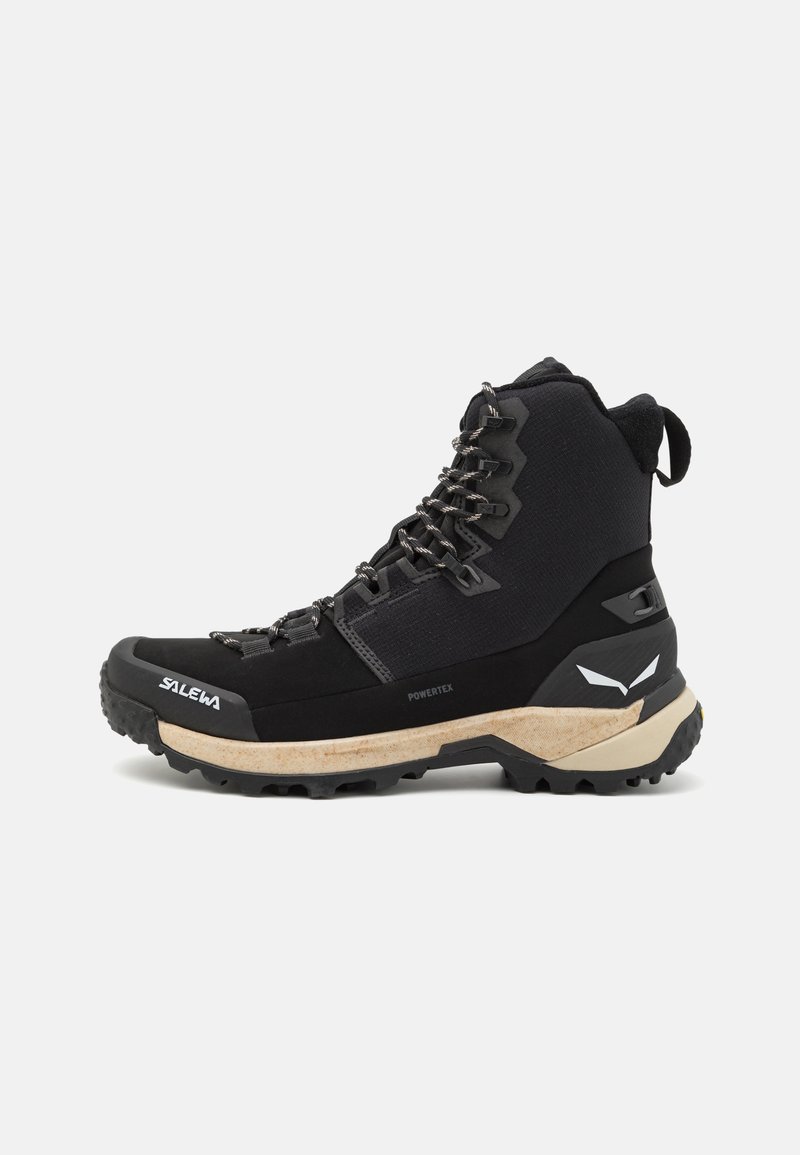 Black hiking boot featuring a waterproof Powertex upper, cushioned midsole, durable rubber outsole, and reinforced toe cap with metal lacing.