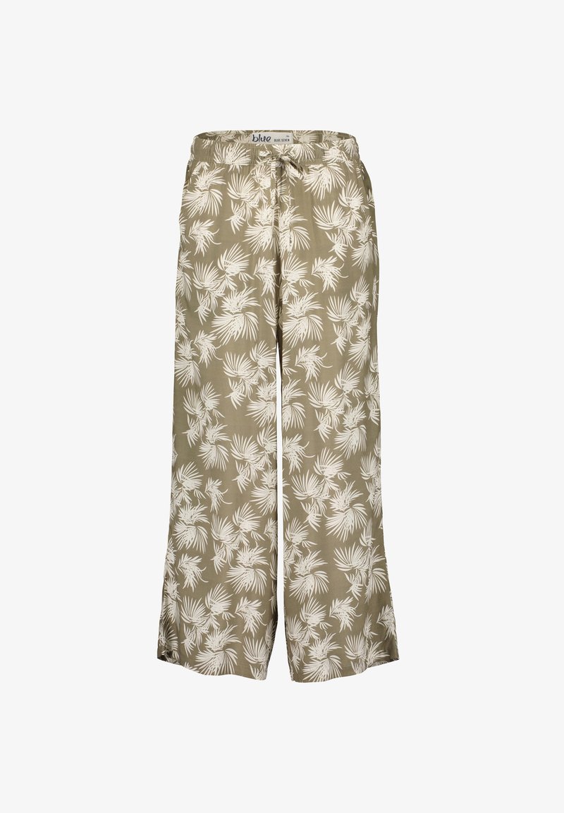 Helle grüne Hose mit weitem Bein, die mit einem weißen tropischen Blättermuster versehen ist. Sie hat einen elastischen Bund und eine Kordelzugdetails für eine verstellbare Passform.