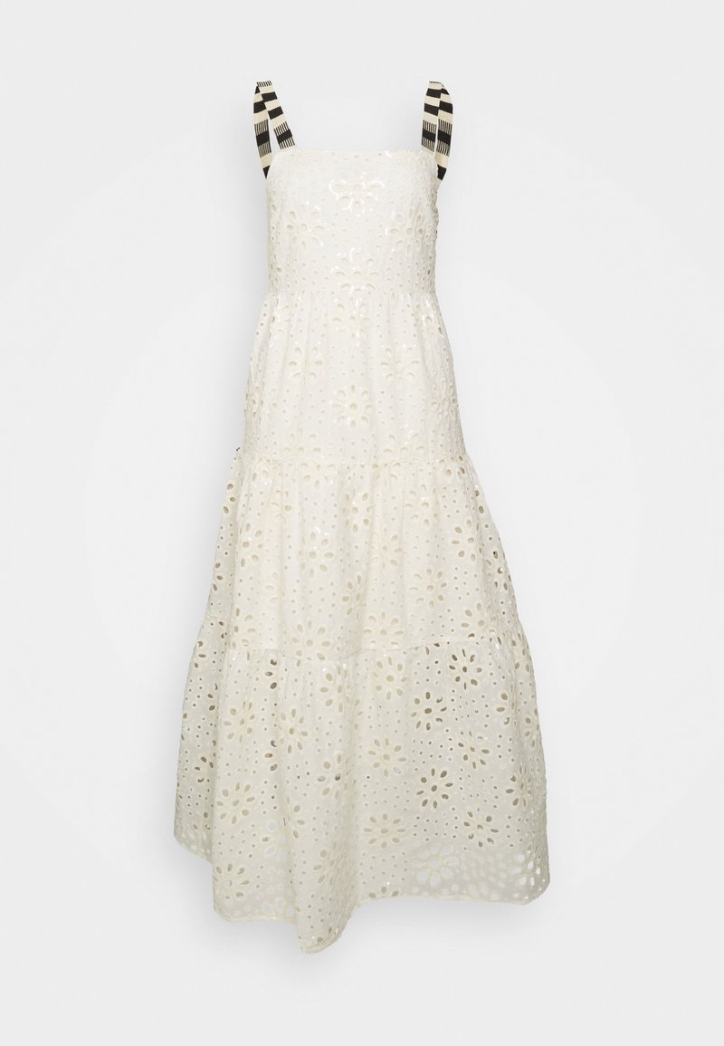 Robe blanche sans manches avec motif œillet floral et bretelles rayées noir et blanc, jupe à volants, longueur midi.