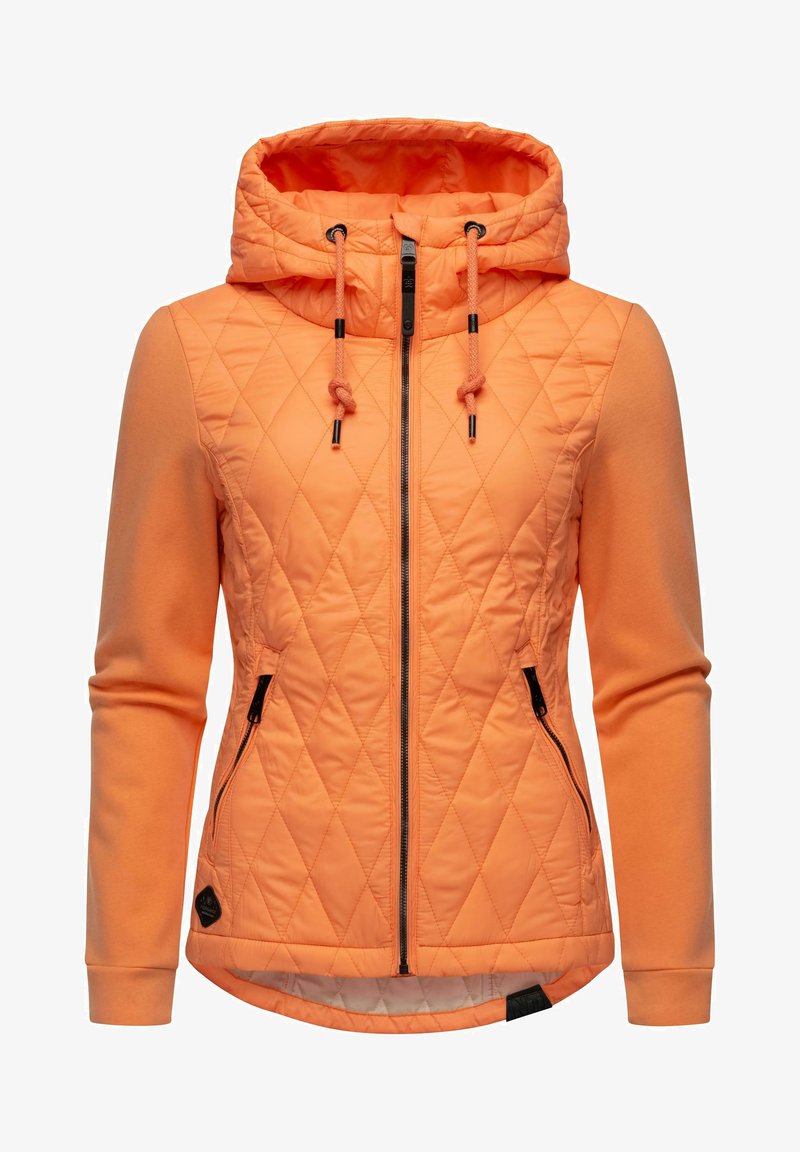 Quilted orange jacket with a hood, featuring a zip closure, drawstrings, side pockets, and ribbed cuffs. Soft fabric with diagonal stitching.