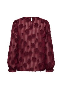 Blusa trasparente bordeaux con un motivo floreale testurizzato, dotata di maniche lunghe e dettaglio a occhiello sulla schiena. Tessuto leggero ed elegante.