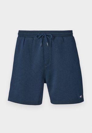 Short décontracté bleu marine avec taille élastique et cordon, avec un petit logo près de l'ourlet en bas de la jambe droite.