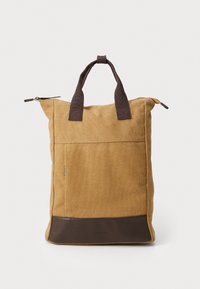 Brown canvas tote bag with dark brown accents, a zippered top, sturdy short handles, and a front pocket. Textured finish throughout.