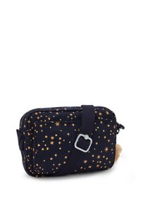 Navy fabric bag with golden star pattern, zip closure, adjustable strap, and a soft beige fur accent on one side. Rectangular shape.