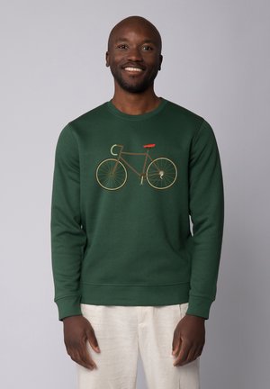 Green sweatshirt featuring a bicycle graphic in brown and orange. The design includes a round neck and ribbed cuffs for a fitted look.