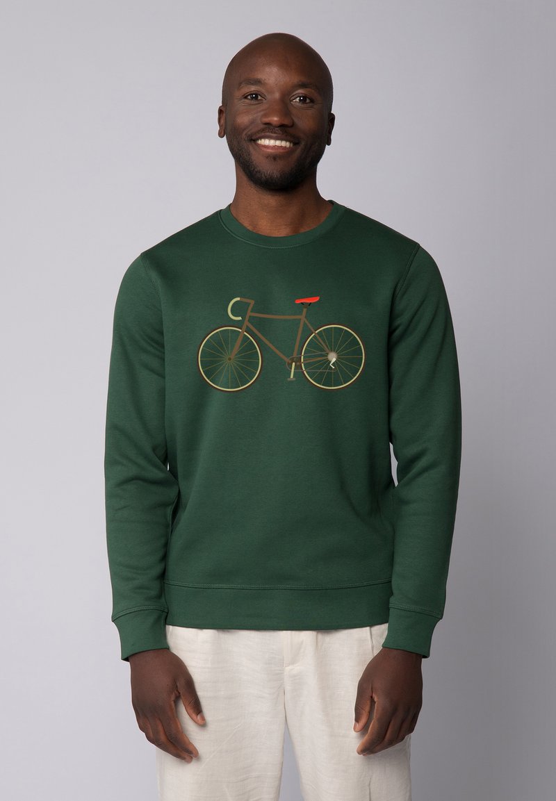 Grüner Sweatshirt mit einem Fahrrad-Design in Braun und Orange. Das Design umfasst einen runden Halsausschnitt und gerippte Bündchen für einen taillierten Look.