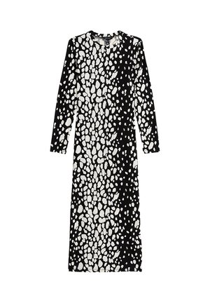 Long-sleeve dress in black and white with a spotted pattern. Made of soft fabric, features a round neckline and a straight cut.