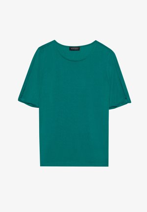 Haut teal à manches courtes en tissu léger. Présente un col rond et une coupe légèrement oversize avec des manches retroussées.