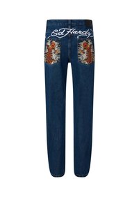 Blue denim jeans featuring embroidered orange koi fish on the back pockets. The waistband displays "Ed Hardy" in white lettering.