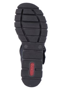 Semelle de chaussure en caoutchouc noir avec des rainures horizontales et verticales pour une meilleure adhérence ; présente un logo rouge et des indications de taille (37, logo de pied).