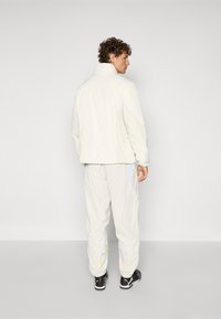 Puma KIDSUPER RBS TRAVEL PANT - Športne kratke hlače - elektro blue/frosted ivory