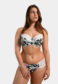 Soutien-gorge à motif floral et slip assorti en blanc, marine et vert. Le soutien-gorge présente des bordures en dentelle et un armature; le slip a des accents en dentelle sur les côtés.