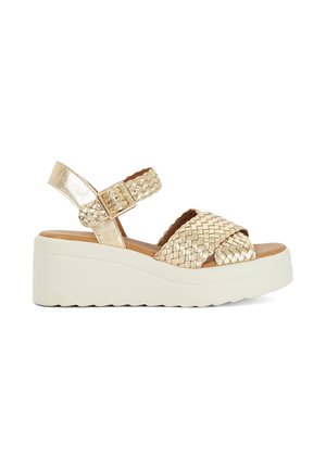 Sandale en métal doré tressé avec bride de cheville réglable, bout rond et semelle plateforme blanche. Bride texturée et semelle intérieure rembourrée.