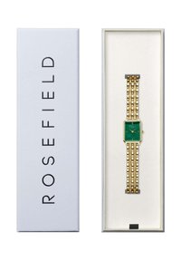 Reloj de metal dorado con una esfera verde rectangular, que presenta marcadores de horas en negrita y un diseño de pulsera de eslabones, presentado en una caja blanca.