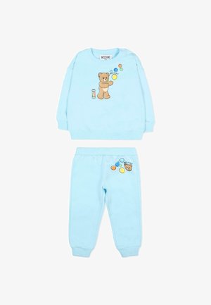 Set per bambini composto da felpa e pantaloni azzurro chiaro con orsetto che soffia bolle e dettagli di bolle colorate su entrambi i capi.