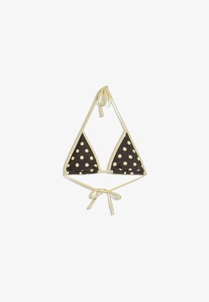 Fekete háromszög bikini felsőrész nagy fehér pöttyökkel és bézs pántokkal, amelyek a nyaknál és a hátnál vannak megkötve, fehér háttéren bemutatva.