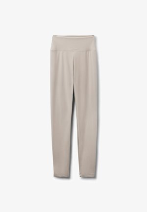 Beige leggings med høj talje, glat stoffinish, tætsiddende design og uden synlige mønstre eller logoer på en hvid baggrund.