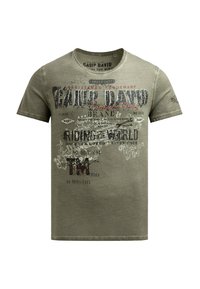 Olive green cotton T-shirt with short sleeves, round neck, and graphic prints in black and red. Text includes "Camp David" and other designs.
