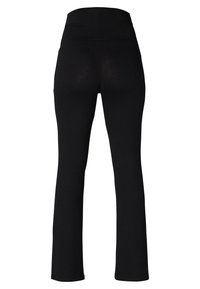 Leggings noirs avec une taille haute, fabriqués à partir d'un tissu extensible. Le design présente une silhouette ajustée et un ourlet évasé.