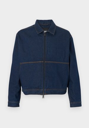Dark blue denim jacket with a zip front, classic collar, and two contrasting seams across the chest. Long sleeves with button cuffs.