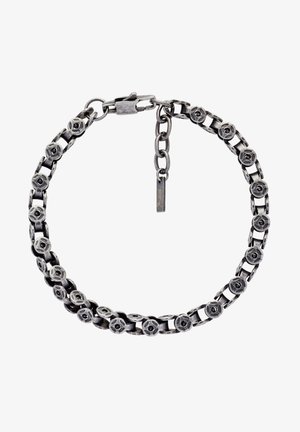 Bracciale in argento con maglie floreali circolari e chiusura regolabile su sfondo bianco.