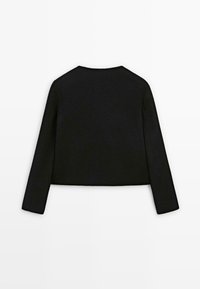 Black cropped sweater with long sleeves, made of soft material. Features a simple design with a straight hem and a round neckline.