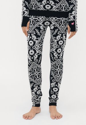 Sorte og grå mønstrede leggins med et intrikat strikket design, som har en tettsittende passform og ribbede mansjetter ved anklene.