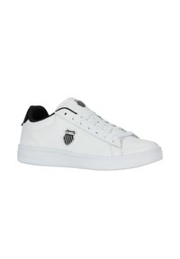 White leather sneaker with black accents, featuring a logo badge, round toe, flat sole, and lace-up design. Smooth texture throughout.