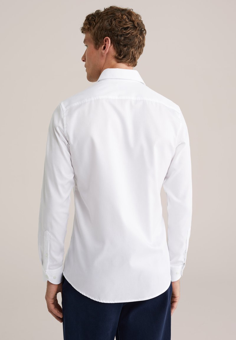 slim fit dress slacks Kenneth Cole Mens Solid Slim-Fit Performance Shirt - White