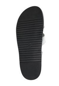 Black rubber shoe sole with horizontal grooves, rounded shape, and a silver metallic accent near the back. Size 40 indicated.