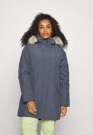 Navy parka with a faux fur-trimmed hood, featuring a zip front, side pockets, and a knee-length cut. The fabric has a smooth texture.