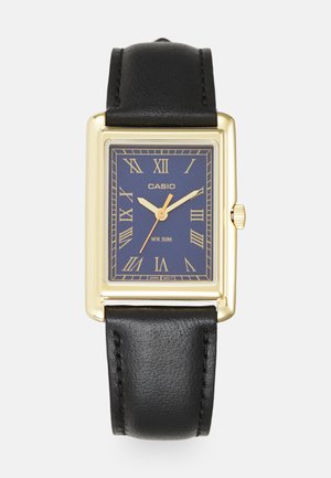 Orologio da polso rettangolare dorato con quadrante blu scuro, numeri romani e cinturino in pelle nera. Impermeabile fino a 50 metri.