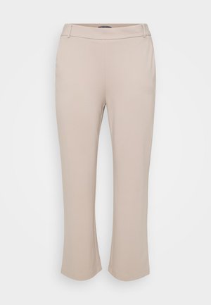 Beżowe spodnie o prostym kroju nogawki. Wykonane z gładkiego, elastycznego materiału. Posiadają średni stan i brak widocznych elementów metalowych.